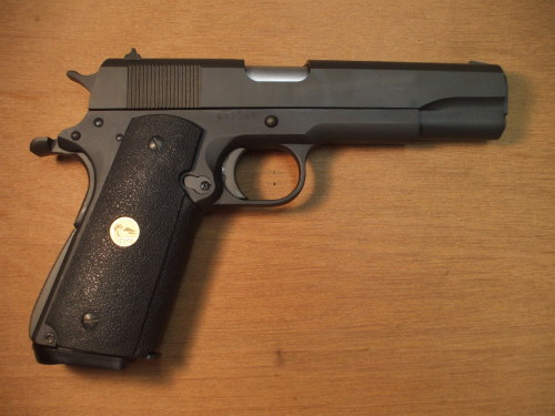 Examine the M1911 pistol.