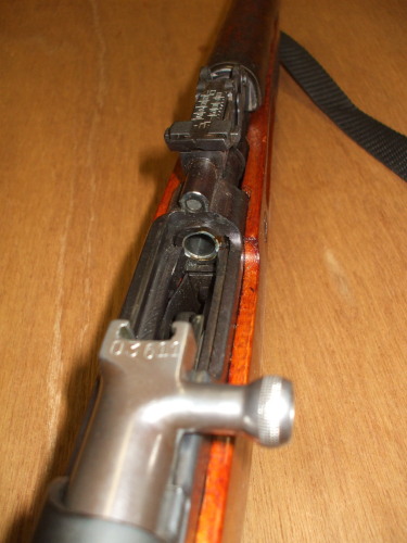 Carefully examine the chamber of the SKS rifle and ensure it is unloaded.