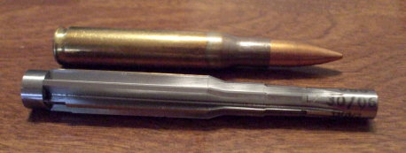 .30-06 cartridge and a .30-06 Springfield chamber reamer.