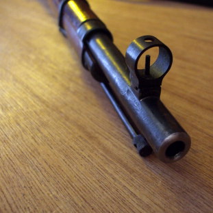 Muzzle and front sight of a Mosin-Nagant rifle.