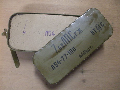 Freshly opened 'Spam Can' of Russian military surplus 7.62x54mmR ammunition.  Cardboard layer on top of the ammunition packs.