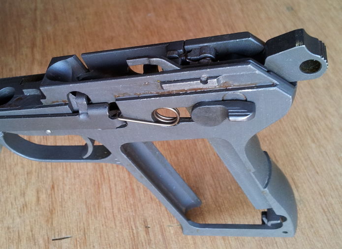 ČZ-52 pistol frame showing hammer, trigger, and safety.