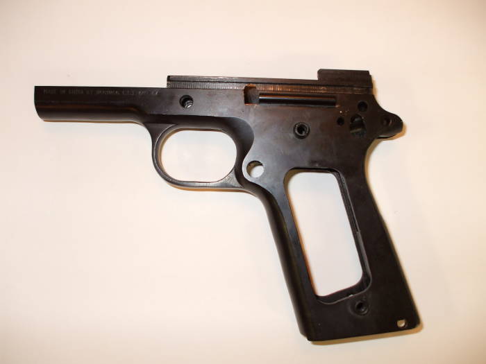 M1911A1 pistol frame.  Oil removed with a spray of brake cleaner.