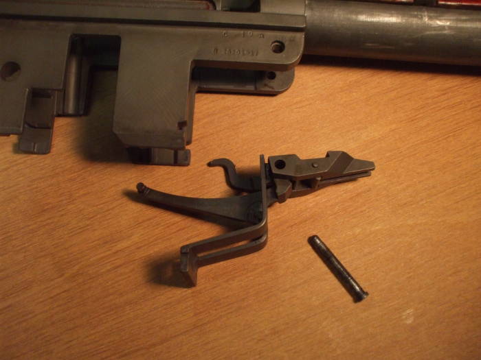 Remove the operating rod catch, follower arm, and bullet guide.