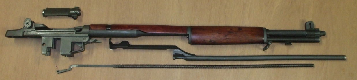 Disassemble the M1 Garand rifle into its major components.