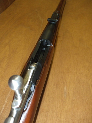 Carefully examine the chamber of the Mosin-Nagant rifle and ensure it is unloaded.