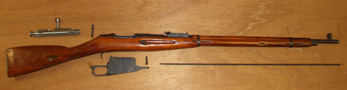 Field strip the Mosin-Nagant, disassembling it into its major components.