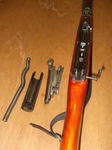 Remove the recoil spring, bolt and bolt carrier.