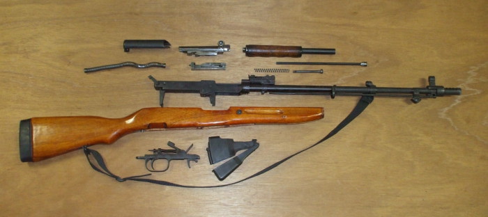 Fully disassemble the SKS rifle into its major components.