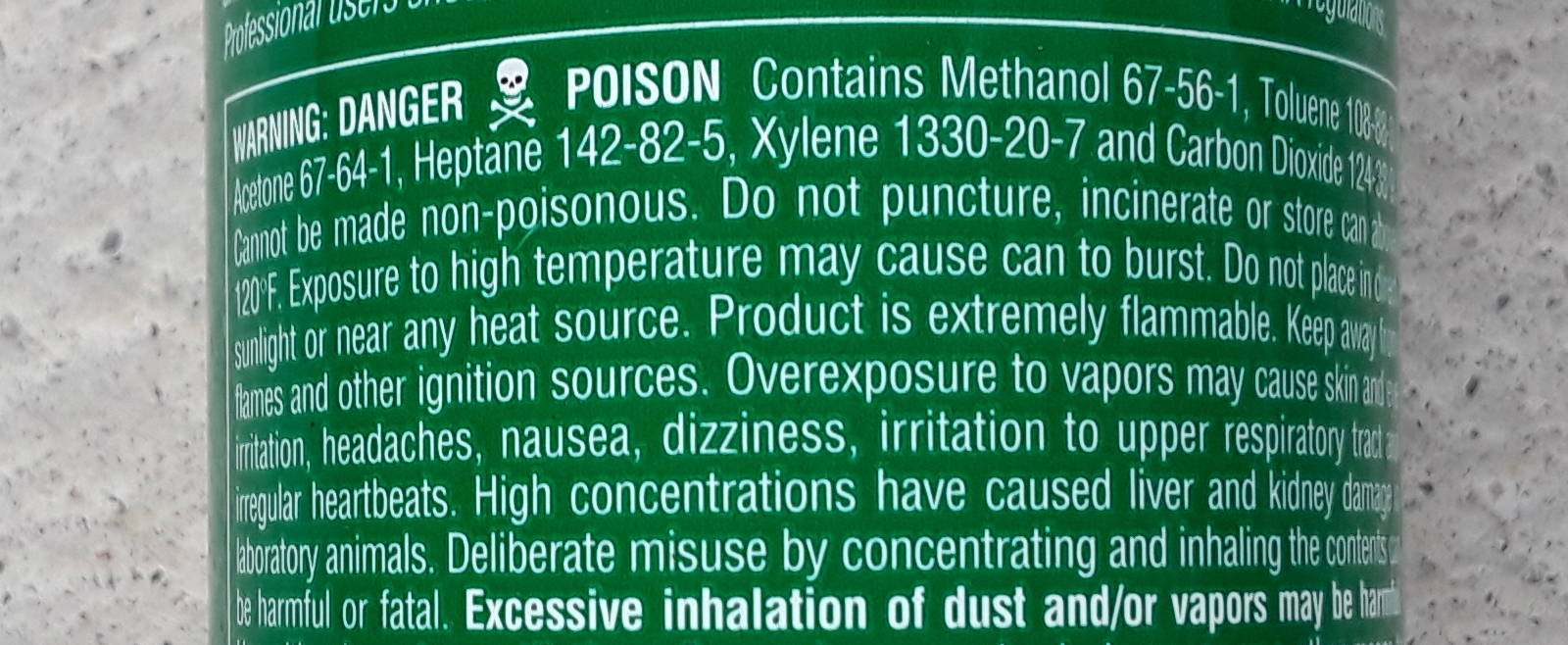 Warning label on non-chlorinated brake cleaner containing acetone, heptane, methanol, and toluene.