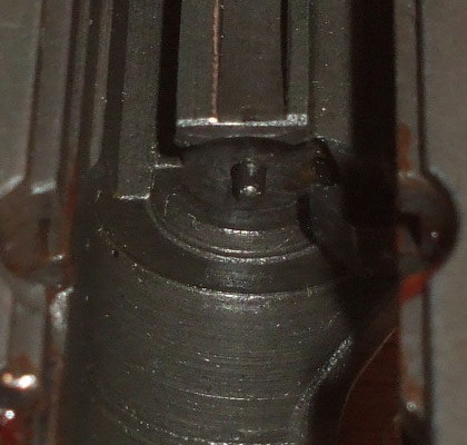 ČZ-52 slide, lying upside down.  The firing pin is protruding from the rear face!  This gun will fire on its own!