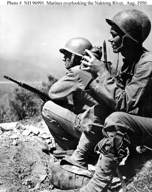 Two U.S. Marines overlooking the Naktong River, South Korea, 19 August 1950.