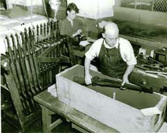 Packing assembled M1 rifles at Springfield Armory in 1942.