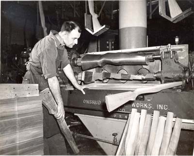 Wood lathe cutting an M1 stock at Springfield Armory