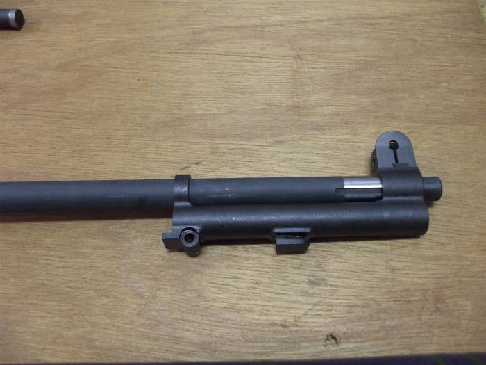 M1 Garand rifle, gas cylinder assembly being placed on barrel.