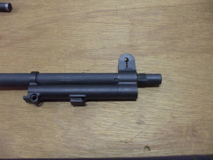 M1 Garand rifle, gas cylinder assembly being placed on barrel.