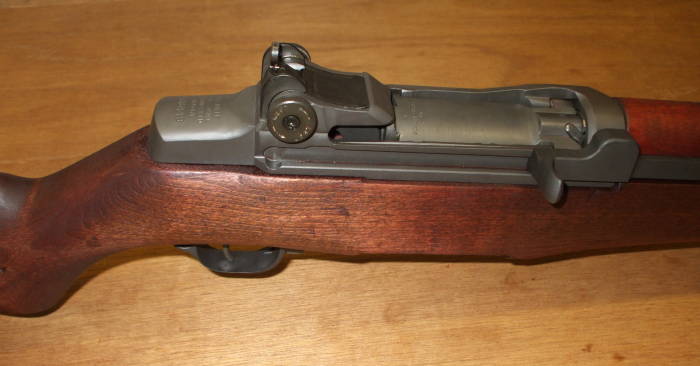 M1 Garand rifle, view of bolt, front sight, operating rod, receiver, and stock.