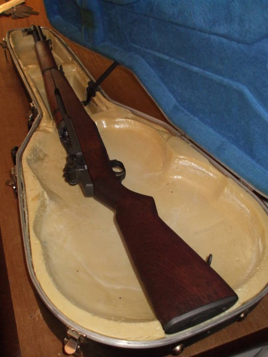 M1 Garand in a custom gun case.  Sitting on top of the original foam, does not yet fit.