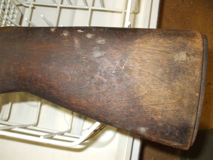 Dishwasher cleaning of an M1 Garand rifle stock.  Lighter wood before cleaning.