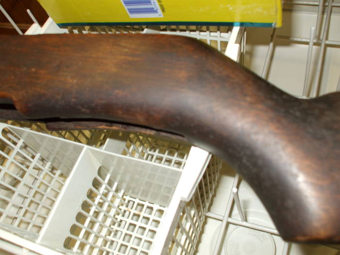 Dishwasher cleaning of an M1 Garand rifle stock.  Darker wood before cleaning.
