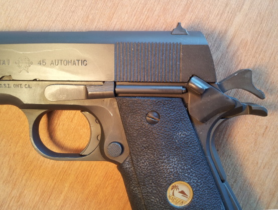 M1911 pistol, manual safety engaged, weapon safe.