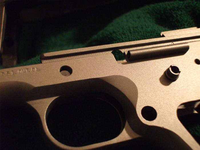 Close-up view of bead blasted pistol frame, ready for parkerizing.
