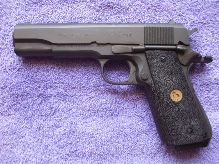 Reassembled parkerized M1911 pistol.