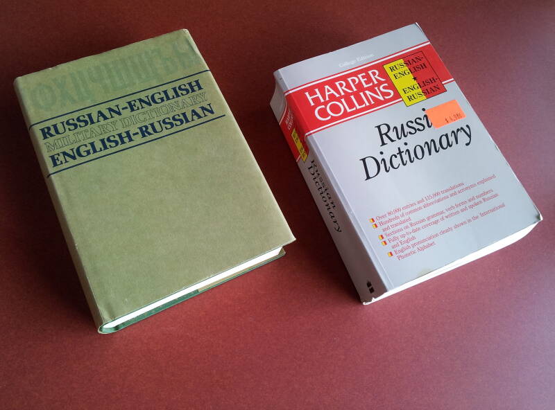 Two Russian-English / English-Russian dictionaries, one general-purpose and the other military.